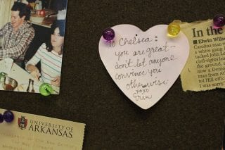 Heart-shaped note pinned to bulletin board reads: "To Chelsea: You are great – don't let anyone convince you otherwise. XOXO Erin