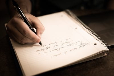photo of handwritten text in a notebook