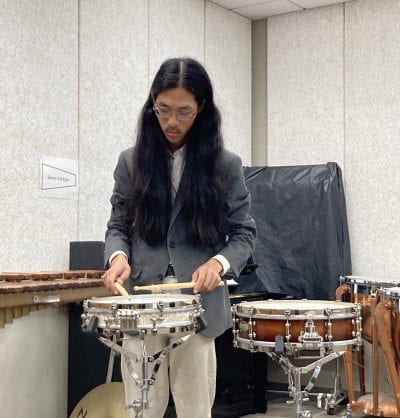 Yoshio playing the snare drum 