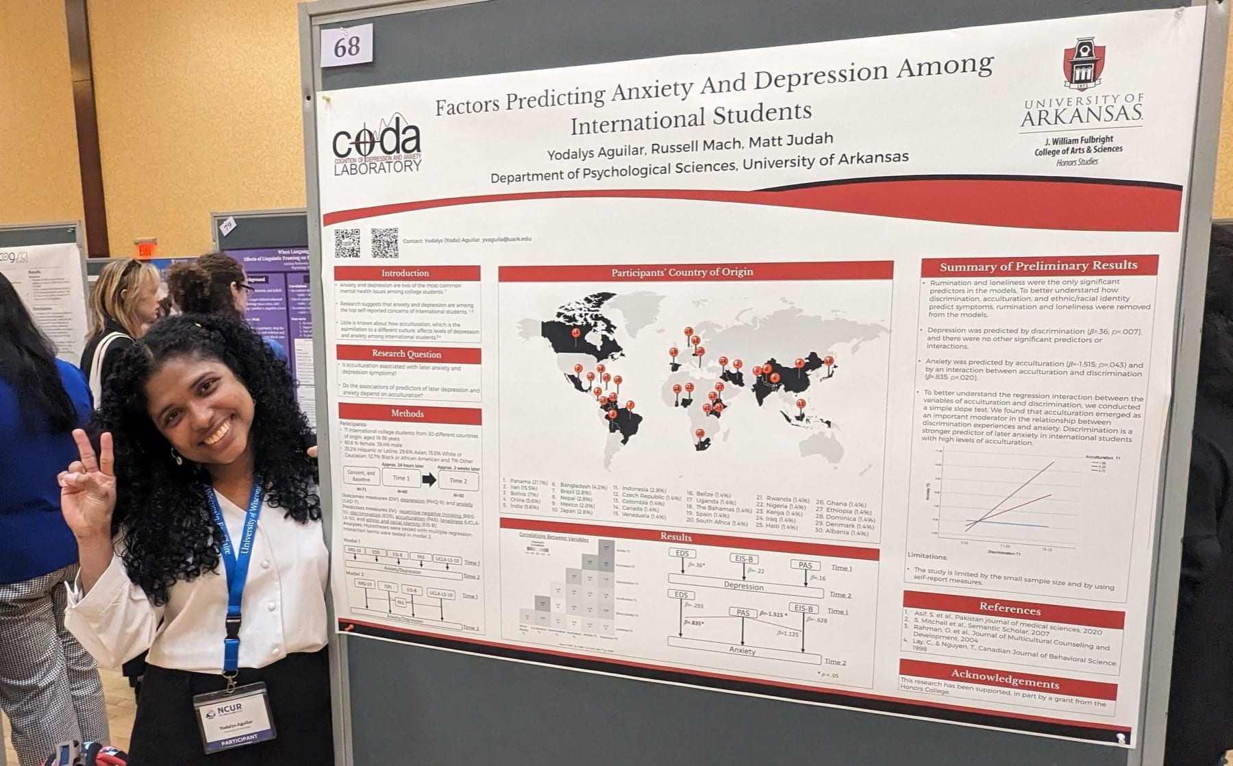 Yodalys with her research poster at the conference 