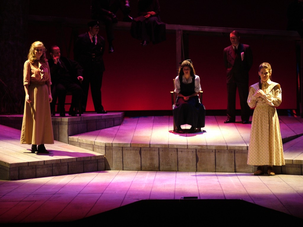 Elizabeth France (seated, center) in the 2004 UA production of Parade, a musical about a 1913 murder trial. 